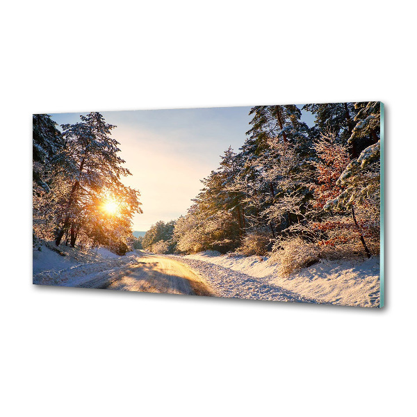 Küchen wandpaneel Eine Straße im Wald im Winter