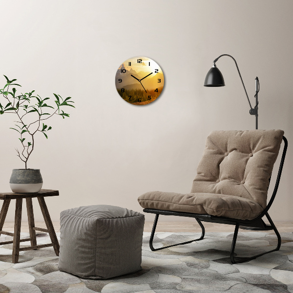 Wanduhr rund Sonnenuntergang in den Bergen