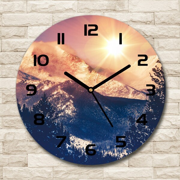 Wanduhr rund Die Sonne über den Bergen