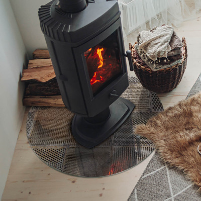 Runde Glasplatte für Kaminofen Lochstahlmotiv