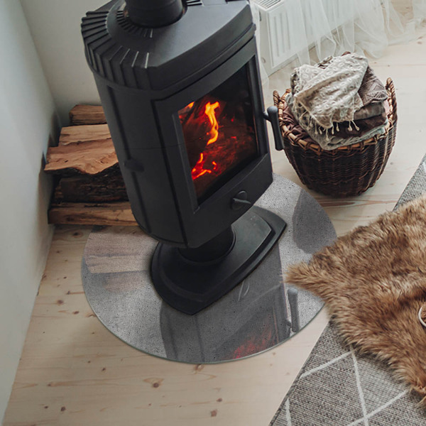 Runde Glasplatte für Kaminofen Betonstruktur im Rohstil