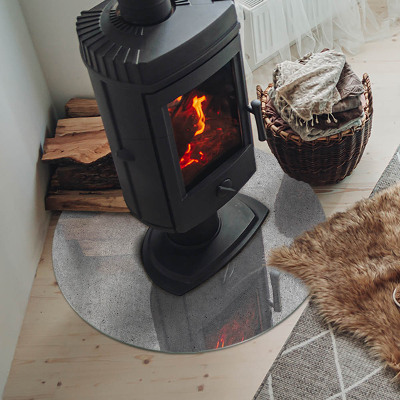 Runde Glasplatte für Kaminofen Betonstruktur im Rohstil