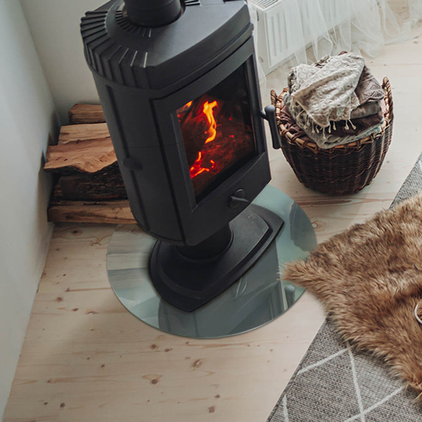 Runde Glasbodenplatte Kamin Marmormotiv in dezenten Farbtönen