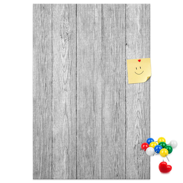 Bedruckte Korkplatte mit Textur von grauen Holzbrettern als Hintergrund