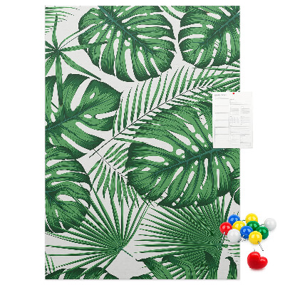 Bedruckte Korkplatte mit Monstera-Blättern auf hellem Hintergrund