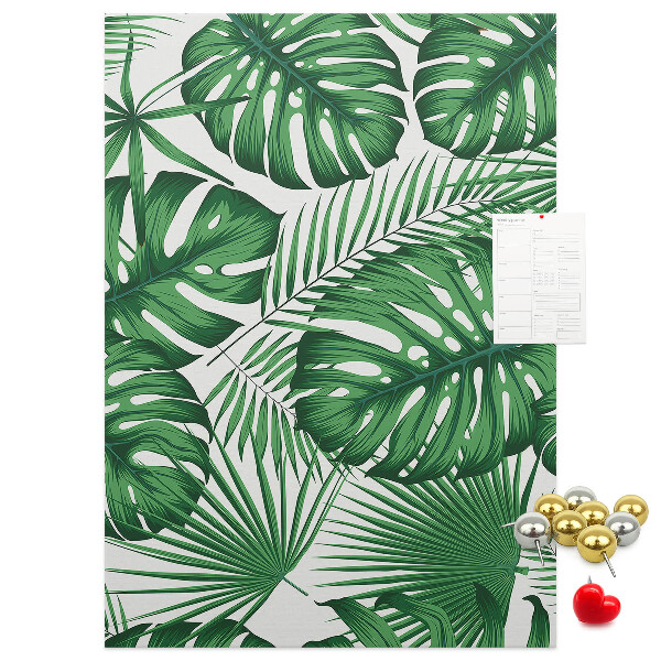Bedruckte Korkplatte mit Monstera-Blättern auf hellem Hintergrund
