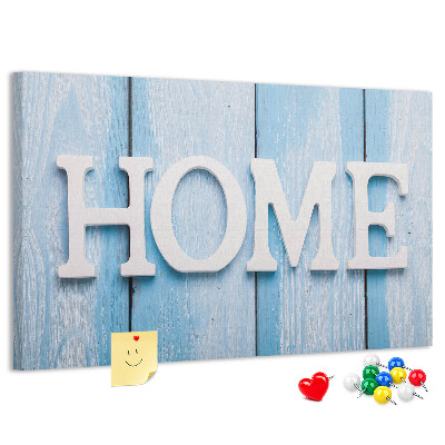 Korktafel mit stilvollem HOME-Schriftzug auf blauem Hintergrund