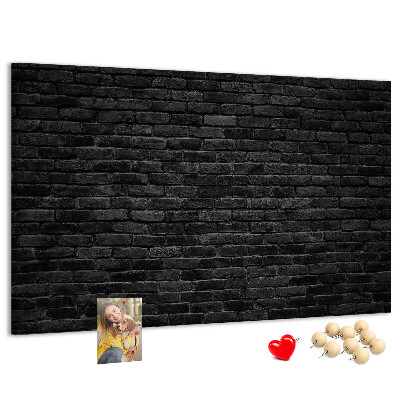 Bild mit Korkrückwand Nahaufnahme einer dunklen strukturierten Backsteinwand