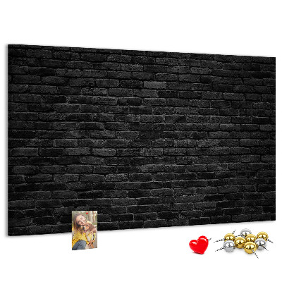 Bild mit Korkrückwand Nahaufnahme einer dunklen strukturierten Backsteinwand