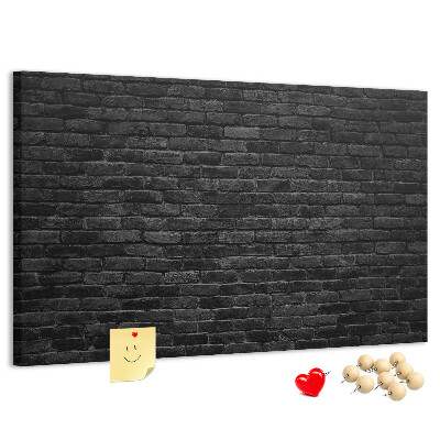 Bild mit Korkrückwand Nahaufnahme einer dunklen strukturierten Backsteinwand