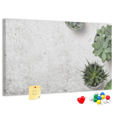 Korktafel mit Motiv Topfpflanzen auf grauem Hintergrund