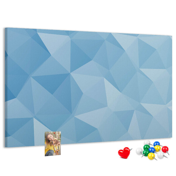 Korkbild mit geometrischen blauen Dreiecken in verschiedenen Schattierungen
