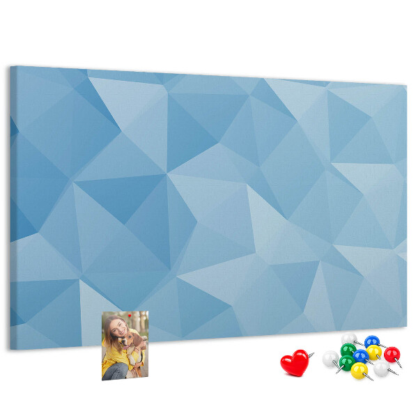 Korkbild mit geometrischen blauen Dreiecken in verschiedenen Schattierungen