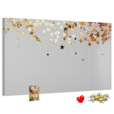 Korkbild mit goldenen Sternen auf grauem Hintergrund