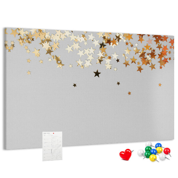 Korkbild mit goldenen Sternen auf grauem Hintergrund