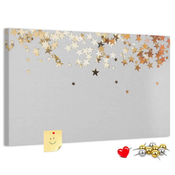 Korkbild mit goldenen Sternen auf grauem Hintergrund