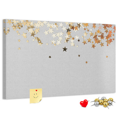 Korkbild mit goldenen Sternen auf grauem Hintergrund