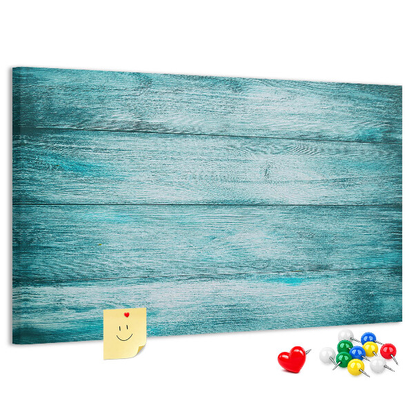 Korktafel mit grünem und blauem Holzbrett-Hintergrund