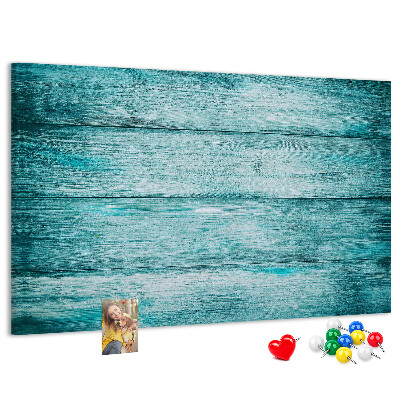 Korktafel mit grünem und blauem Holzbrett-Hintergrund