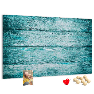 Korktafel mit grünem und blauem Holzbrett-Hintergrund