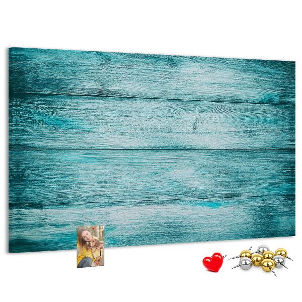 Korktafel mit grünem und blauem Holzbrett-Hintergrund