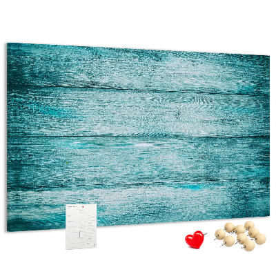 Korktafel mit grünem und blauem Holzbrett-Hintergrund