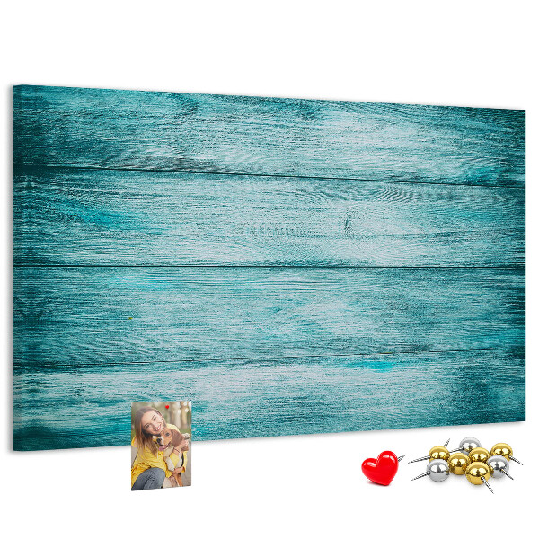 Korktafel mit grünem und blauem Holzbrett-Hintergrund