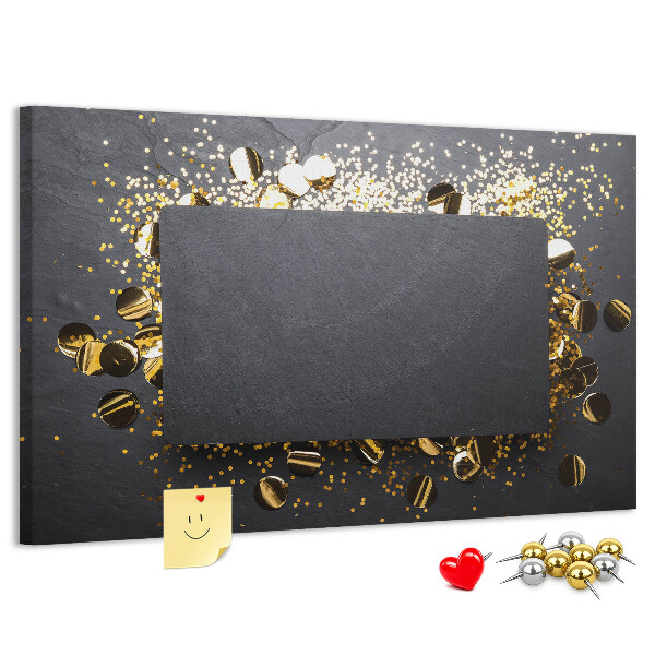 Korkbild goldenes Konfetti auf schwarzem Hintergrund