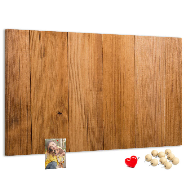 Korkbild mit farbigen Stecknadeln auf Holzbrett