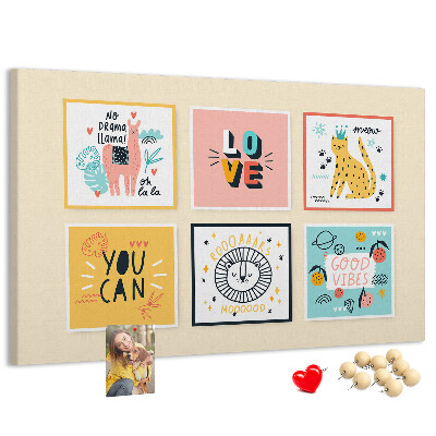 Korktafel mit farbenfrohen Grafiken und positiven Slogans