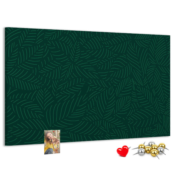 Korktafel mit Motiv grüne Blätter auf dunklem Hintergrund