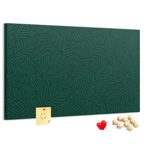 Korktafel mit Motiv grüne Blätter auf dunklem Hintergrund