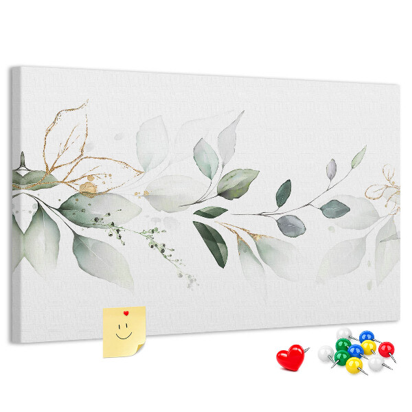 Korktafel mit zarten Blättern und goldenen Akzenten