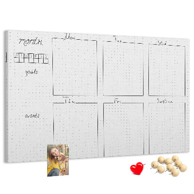 Planer mit Raster und Korkrückwand zur Organisation Ihrer Zeit