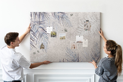 Korktafel zarte Blätter auf grauem Hintergrund