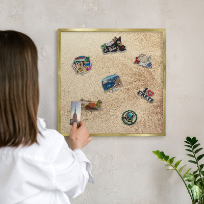 Magnettafel für Urlaubsmagnete in Goldrahmen Sandblätter